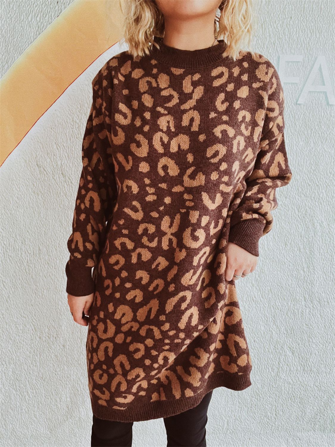 Leopard knit mini dress in brown with a crew neck and long sleeves.