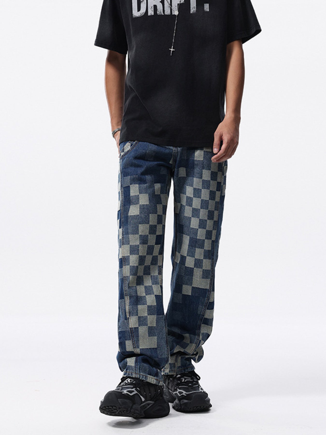 Checkerboard pattern relaxed fit jeans in blue denim with a contemporary style.