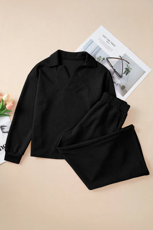Black quilted knit collared loungewear set with V-neck top and drawstring pants.