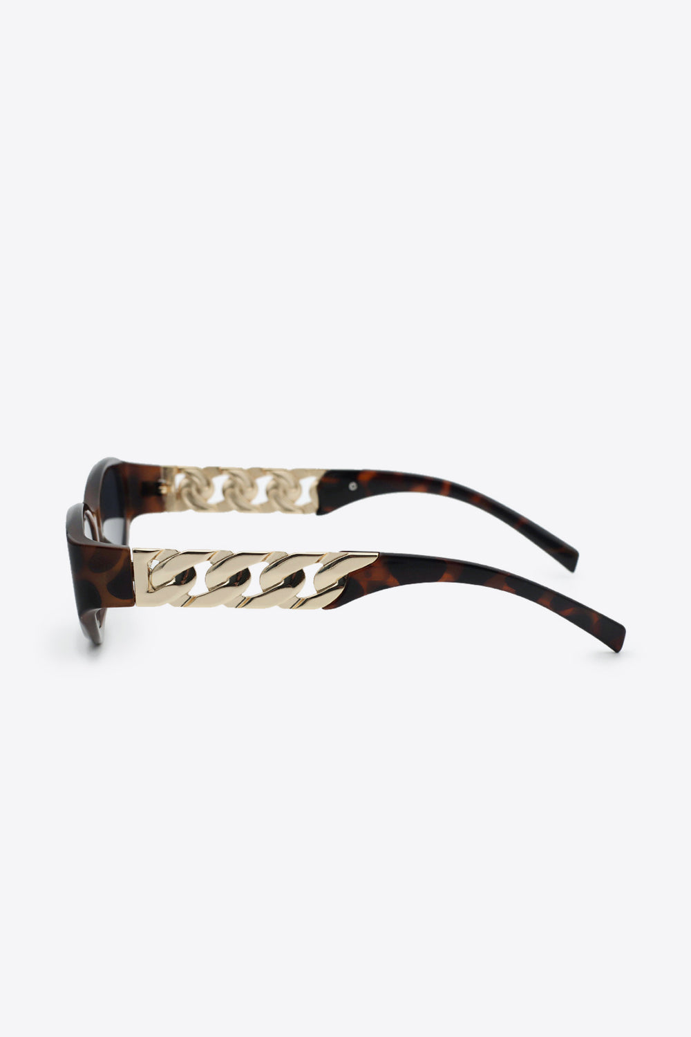 Tortoiseshell cat-eye sunglasses with gold chain detail on the temples.