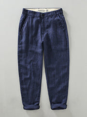 Blue linen cropped sweatpants for men with elastic waistband and cuffed hems.