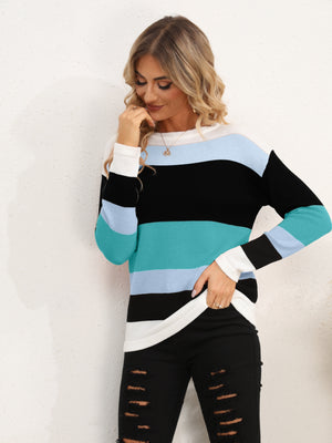 Colorblock crewneck sweater with horizontal stripes in teal, black, and white.