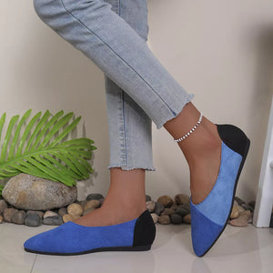 Chic pointed-toe slip-on flats in blue and black color block with a casual style.