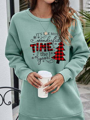 Sage tunic sweatshirt with holiday graphic and buffalo plaid Christmas tree.