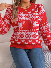 Red acrylic sweater with white reindeer, snowflake, and heart pattern.