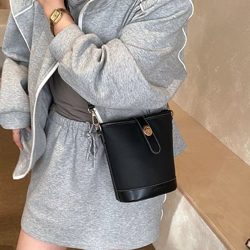 Bucket Leather Crossbody Bag in Black, model styling view