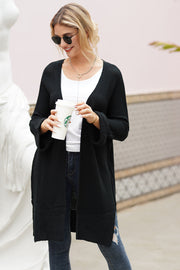 Textured open-front maxi knit cardigan in black with a relaxed fit and ribbed cuffs.