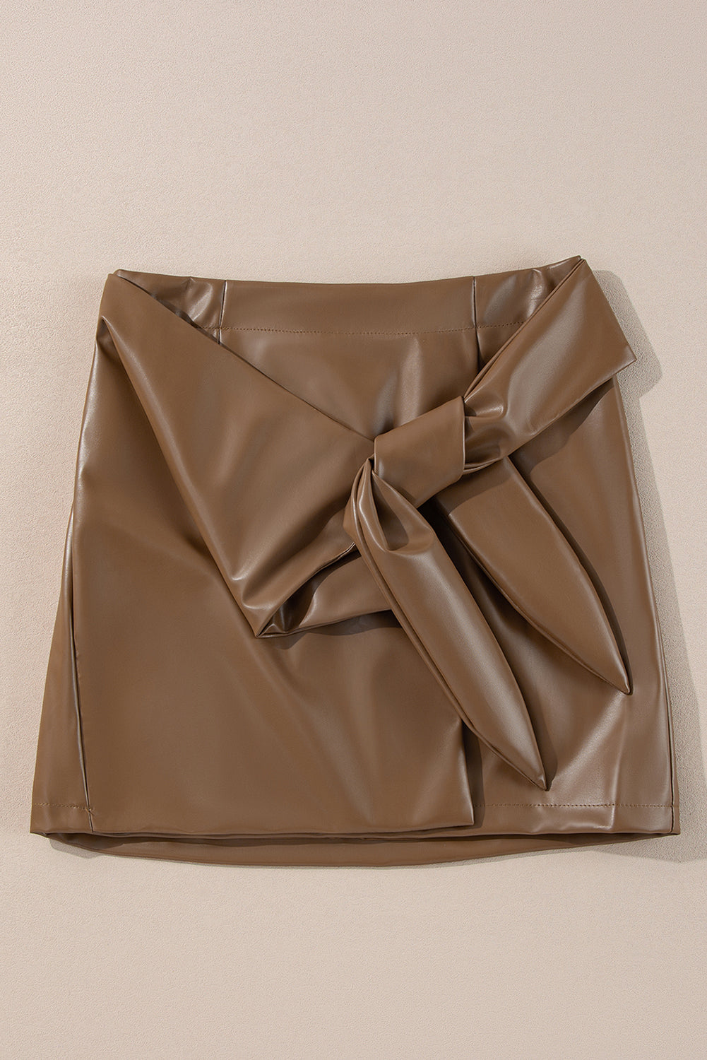 Brown faux leather mini skirt with a knot-front detail.