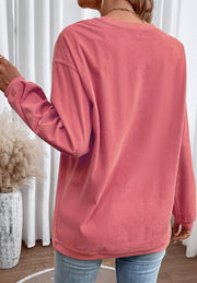 Burnt coral corduroy sweatshirt with long sleeves and a crew neck.