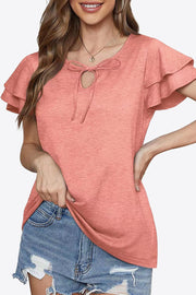 Peach tiered sleeve keyhole blouse with tie detail and ruffled sleeves.