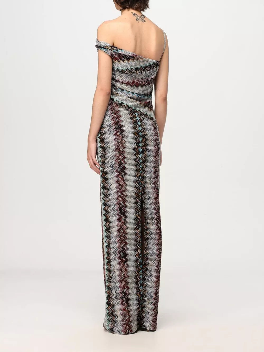 Vibrant one-shoulder maxi dress with chevron pattern and asymmetrical neckline.