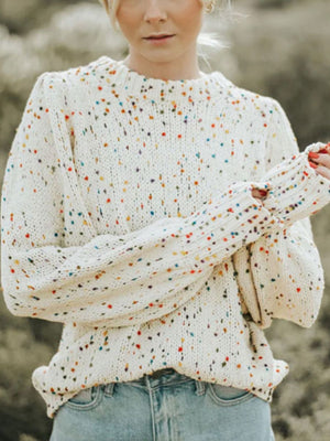 Cream speckled knit sweater with puff sleeves and a crew neck.