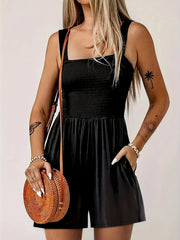 Black smocked bodice wide-leg jumpsuit with square neckline and pockets