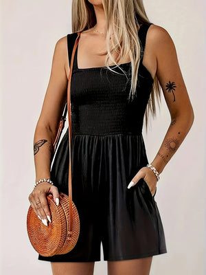Black smocked bodice wide-leg jumpsuit with square neckline and pockets