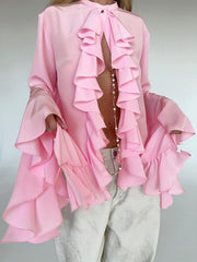Pink ruffled flounce sleeve blouse with buttoned neckline and airy fabric.