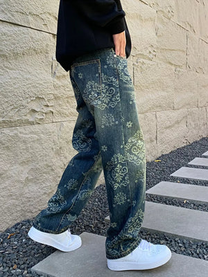 Men's relaxed fit jeans in dark wash denim with an all-over heritage floral print.