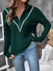 Dark green textured knit sweater with chevron trim and zip neck.