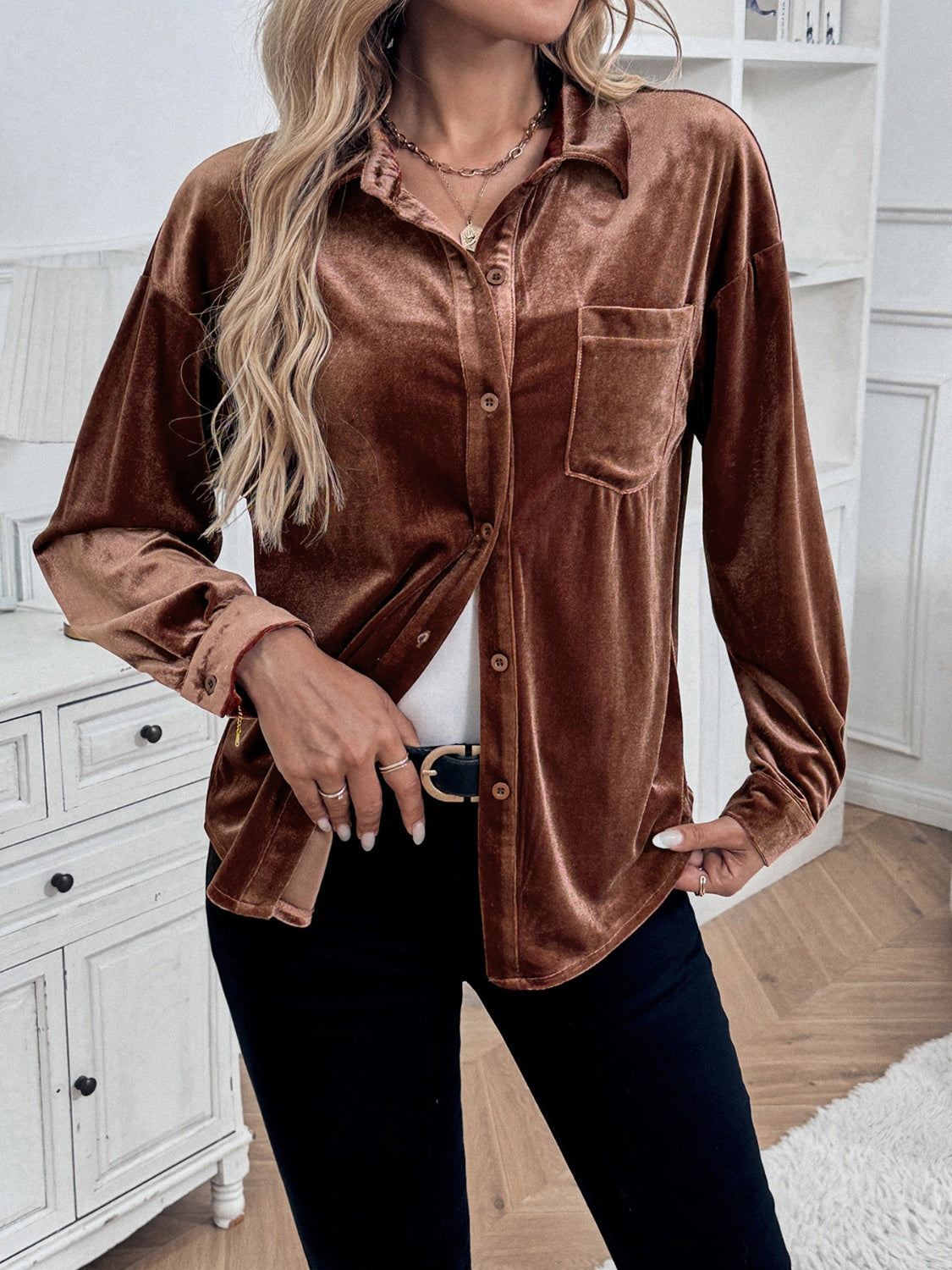 Brown velvet button-up blouse with blouson sleeves and a chest pocket.