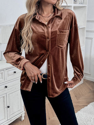 Brown velvet button-up blouse with blouson sleeves and a chest pocket.