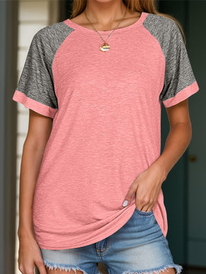 Raglan sleeve tee in pink with gray sleeves and crew neck.
