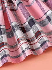 Children's pink plaid dress with ruffled hem detail