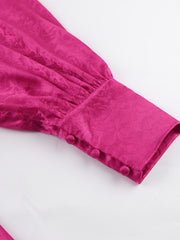 Vibrant cerise mini dress with lantern sleeves, jacquard pattern, and button cuff detail.