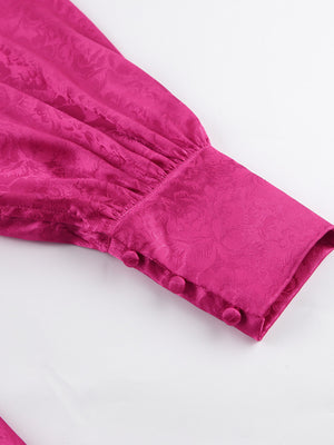 Vibrant cerise mini dress with lantern sleeves, jacquard pattern, and button cuff detail.