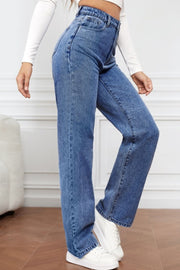 Light blue wide-leg denim jeans with a sculpted high rise, styled with white sneakers.