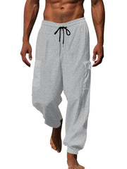 Light gray waffle knit joggers with drawstring and cargo pockets.