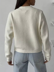 White textured knit cardigan with crewneck and ribbed cuffs and hem.