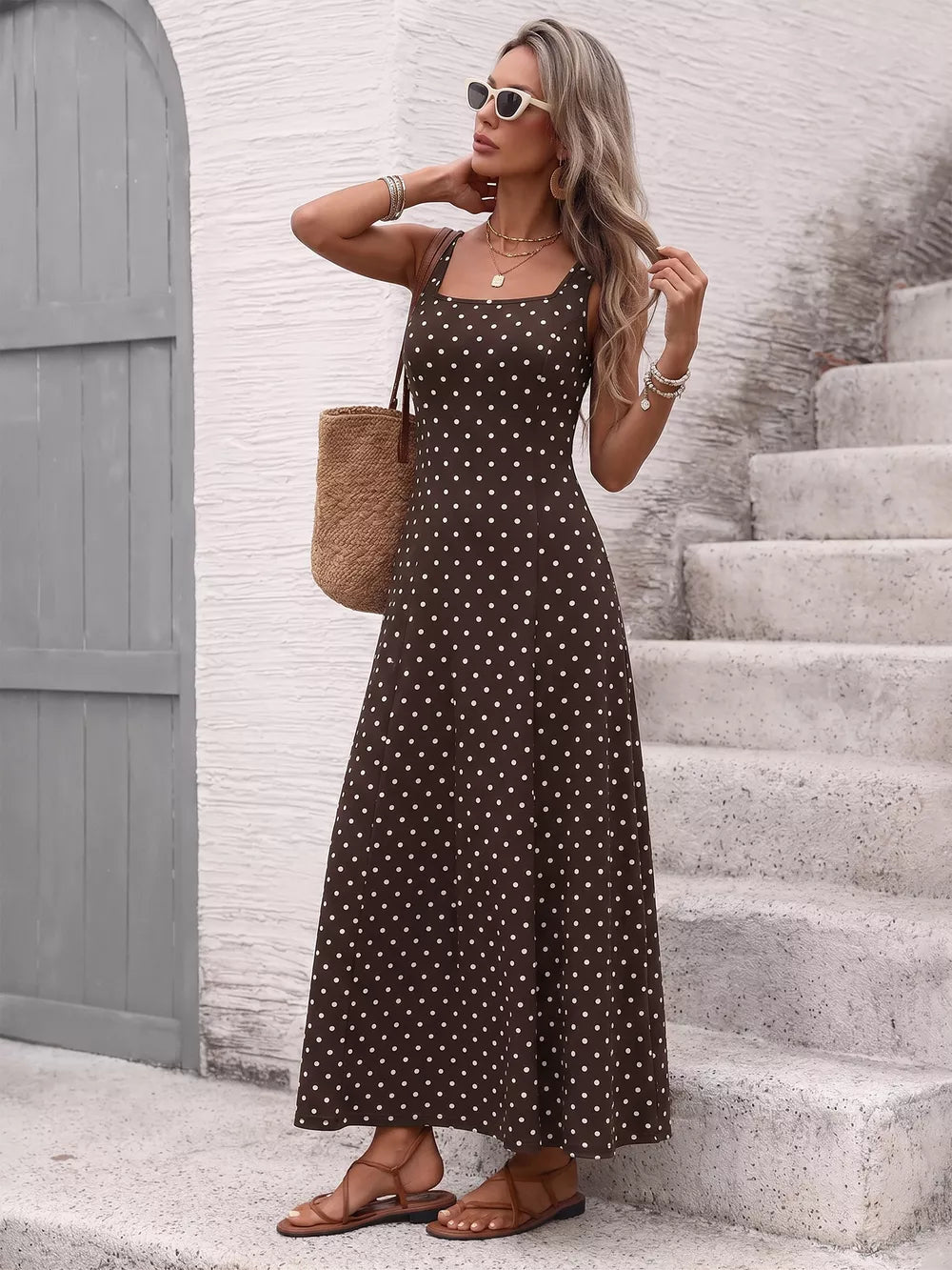 Brown polka dot maxi dress with square neckline and thin straps.