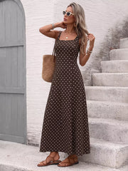 Brown polka dot maxi dress with square neckline and thin straps.