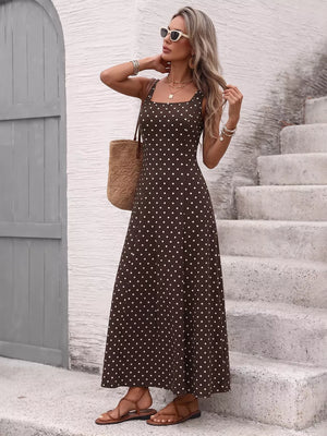 Brown polka dot maxi dress with square neckline and thin straps.