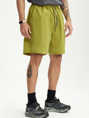 Men's olive green chino shorts with drawstring waist and pockets.