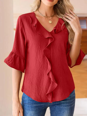 Red maternity shirt with cascading ruffles and 3/4 bell sleeves.