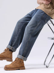 Men's blue vintage wash loose fit jeans with cuffed hems, cotton.