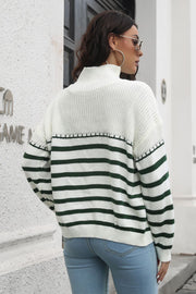 Turtleneck sweater with green and white Breton stripes and acrylic knit.