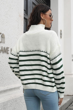 Turtleneck sweater with green and white Breton stripes and acrylic knit.