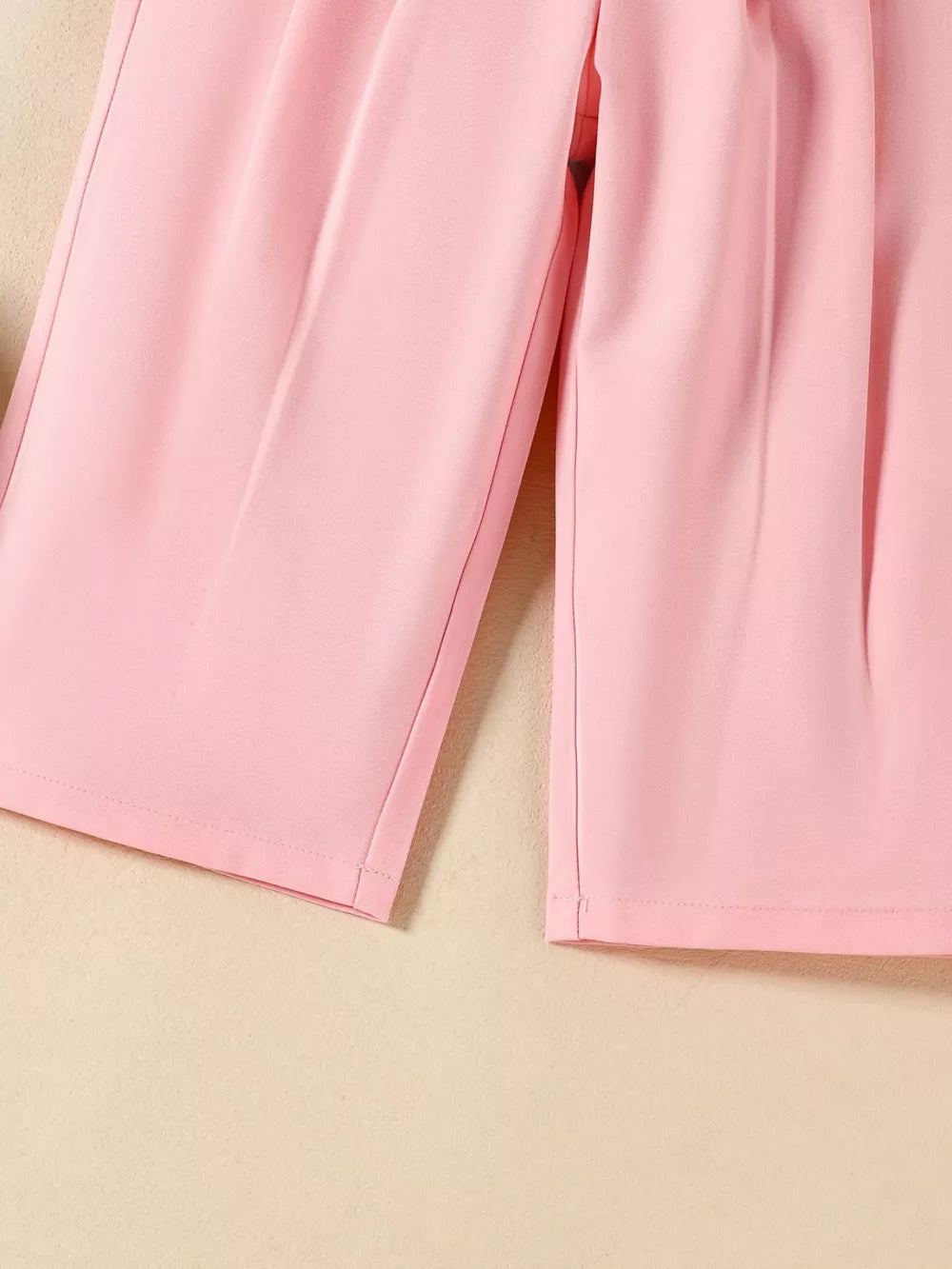 Pink baby outfit pants with pleated detail and wide leg