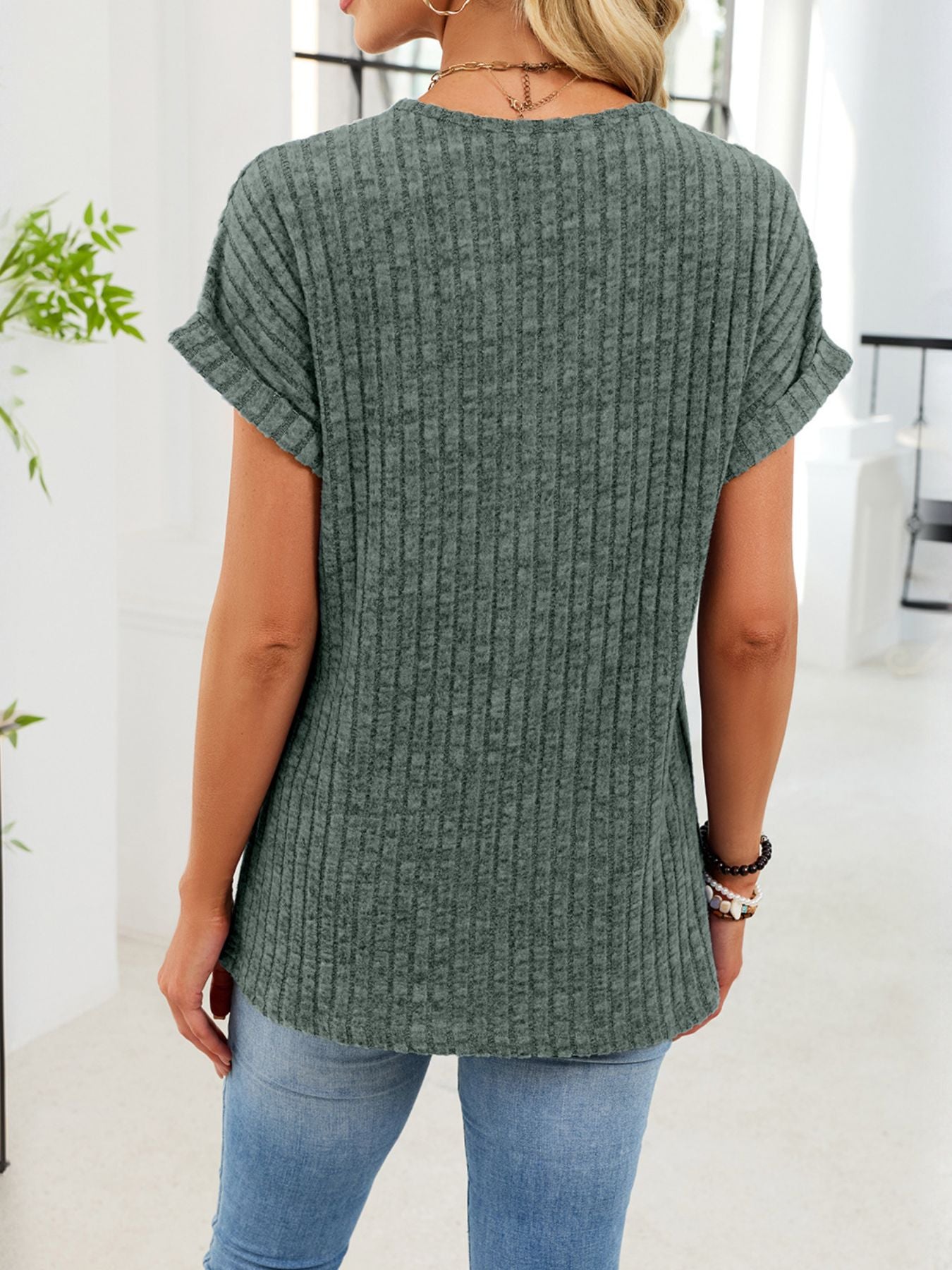 Ribbed knit V-neck t-shirt in Army Green with cuffed short sleeves and button detail.