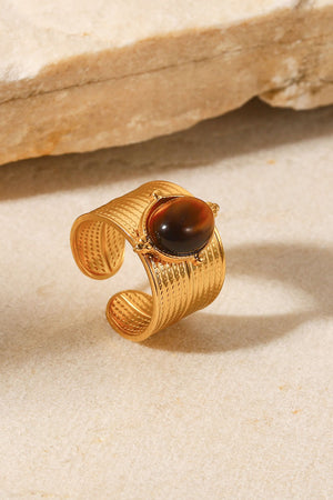 Textured cuff ring with brown tiger's eye stone and gold finish