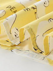 Toddler dress in yellow cotton blend with a dove print and ruffle sleeves.