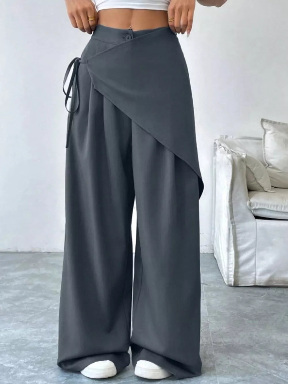 Chic dark gray high-waisted wide-leg maternity trousers with wrap detail and tie.