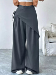 Chic dark gray high-waisted wide-leg maternity trousers with wrap detail and tie.