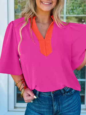 Textured pink blouse with orange V-neck trim and half sleeves