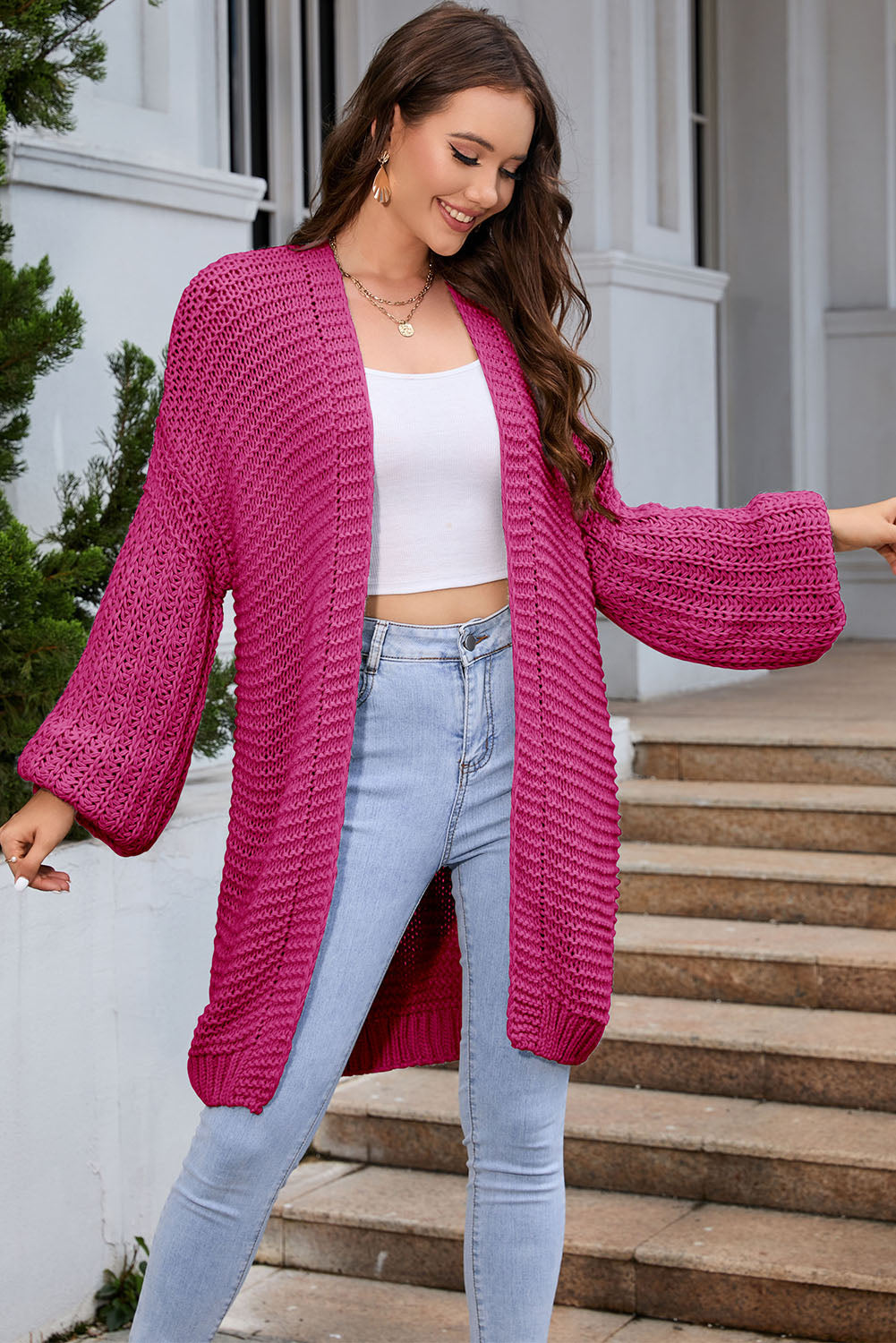 Hot Pink textured knit cocoon cardigan with balloon sleeves and open front.