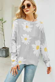 Light gray intarsia knit sweater with white daisy pattern, crew neck, and cable knit details.
