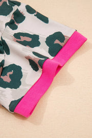 Pajama sleeve detail with abstract leopard print and pink trim