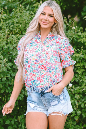Floral ruffle collar puff sleeve blouse with a button-up front and short sleeves.