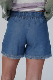 Denim drawstring shorts in navy with frayed hem and elastic waistband.